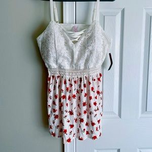 fitted crotchet bust/waist, flowing waistline featuring tiny red flowers.